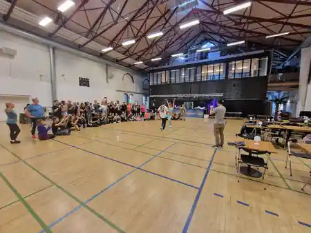Dance class with couples on wooden floor at Kedelhallen Copenhagen — salsa, bachata venue in Copenhagen