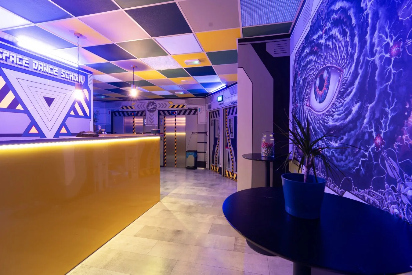 Abra Studio reception area with Space Dance School mural and artistic wall art in Warsaw