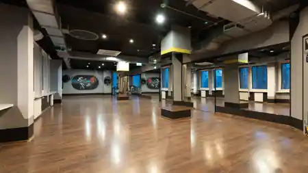 Abra Studio spacious dance floor with wall-to-wall mirrors and space-themed murals in Warsaw — bachata venue in Warsaw