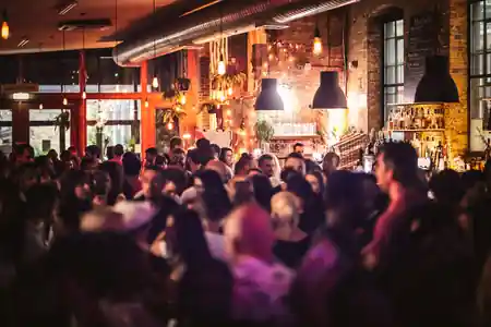 Packed social event at Juju's Bar and Stage London with warm lighting and crowd enjoying the atmosphere — salsa venue in London
