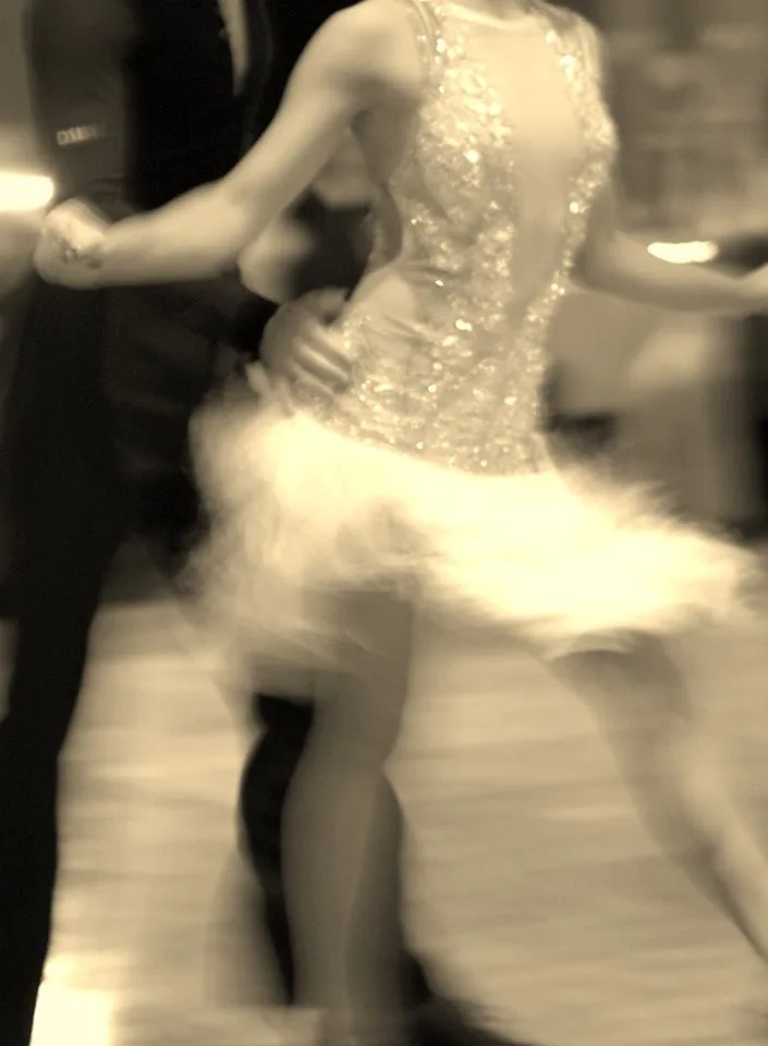 Sepia-toned partner dance couple performing salsa at Danza Pasion Perth Australia