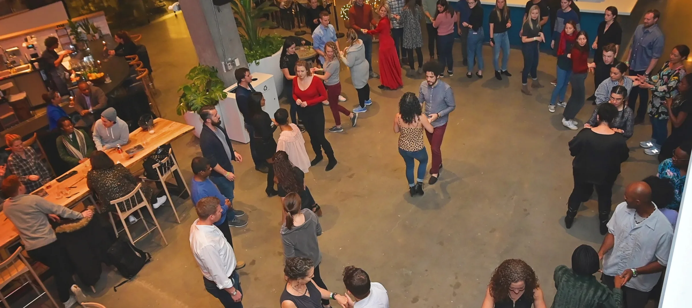 Overhead view of a packed Baila DC social dance party at La Cosecha in Washington D.C.