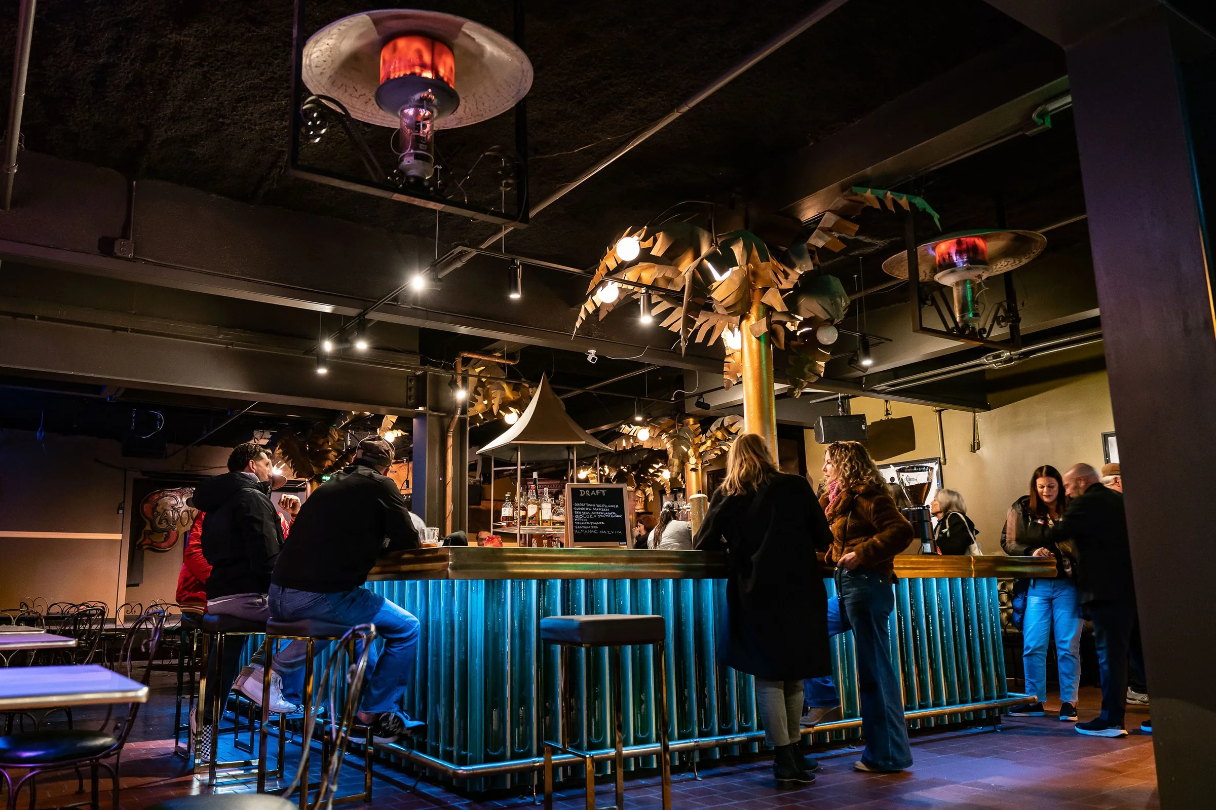 Bar and lounge interior with patrons at Savoy Tivoli in San Francisco