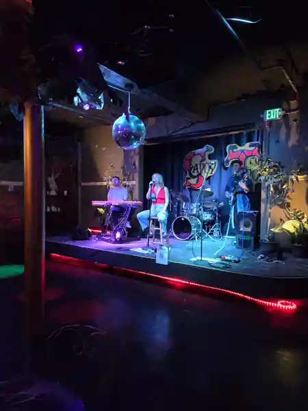Live band performing on stage with disco ball and dance floor at Savoy Tivoli in San Francisco — salsa venue in San Francisco