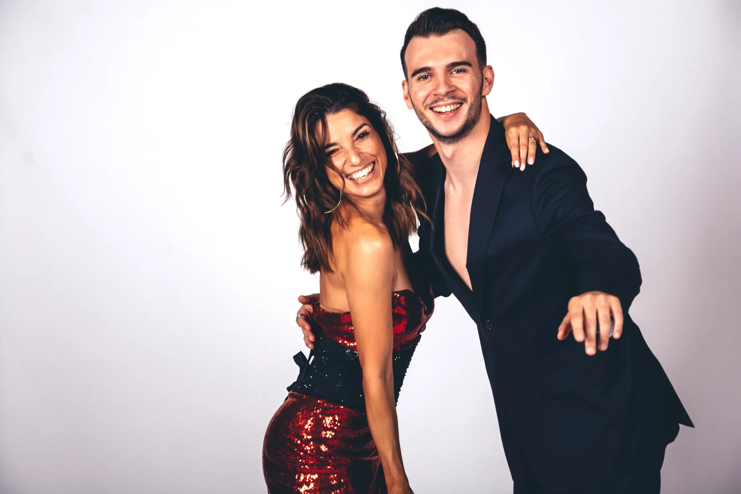 Dance couple in elegant Latin dance attire at Akademia Tanca in Atlas Tower Warsaw