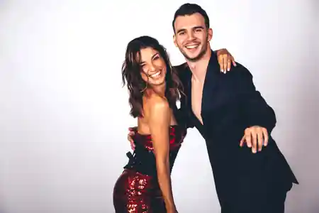 Dance couple in elegant Latin dance attire at Akademia Tanca in Atlas Tower Warsaw — bachata, salsa, kizomba venue in Warsaw