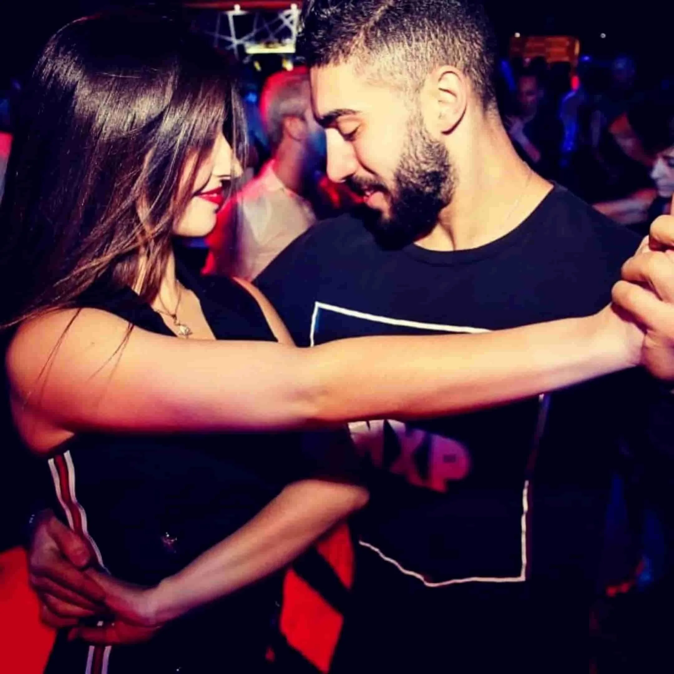 Couple in close bachata hold on the dance floor at Salsa Foundation Melbourne