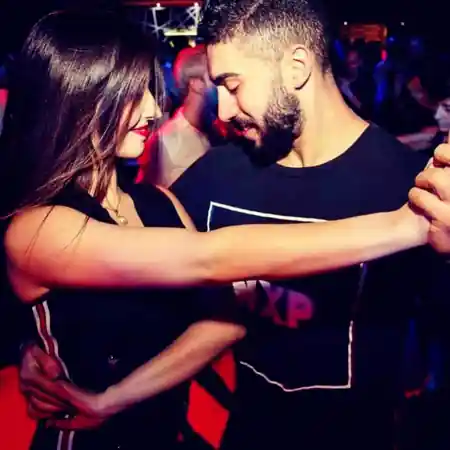 Couple in close bachata hold on the dance floor at Salsa Foundation Melbourne