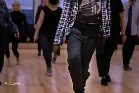 Dancers practicing footwork on the wooden sprung floor at You Should Be Dancing studio in NYC — salsa, bachata venue in New York