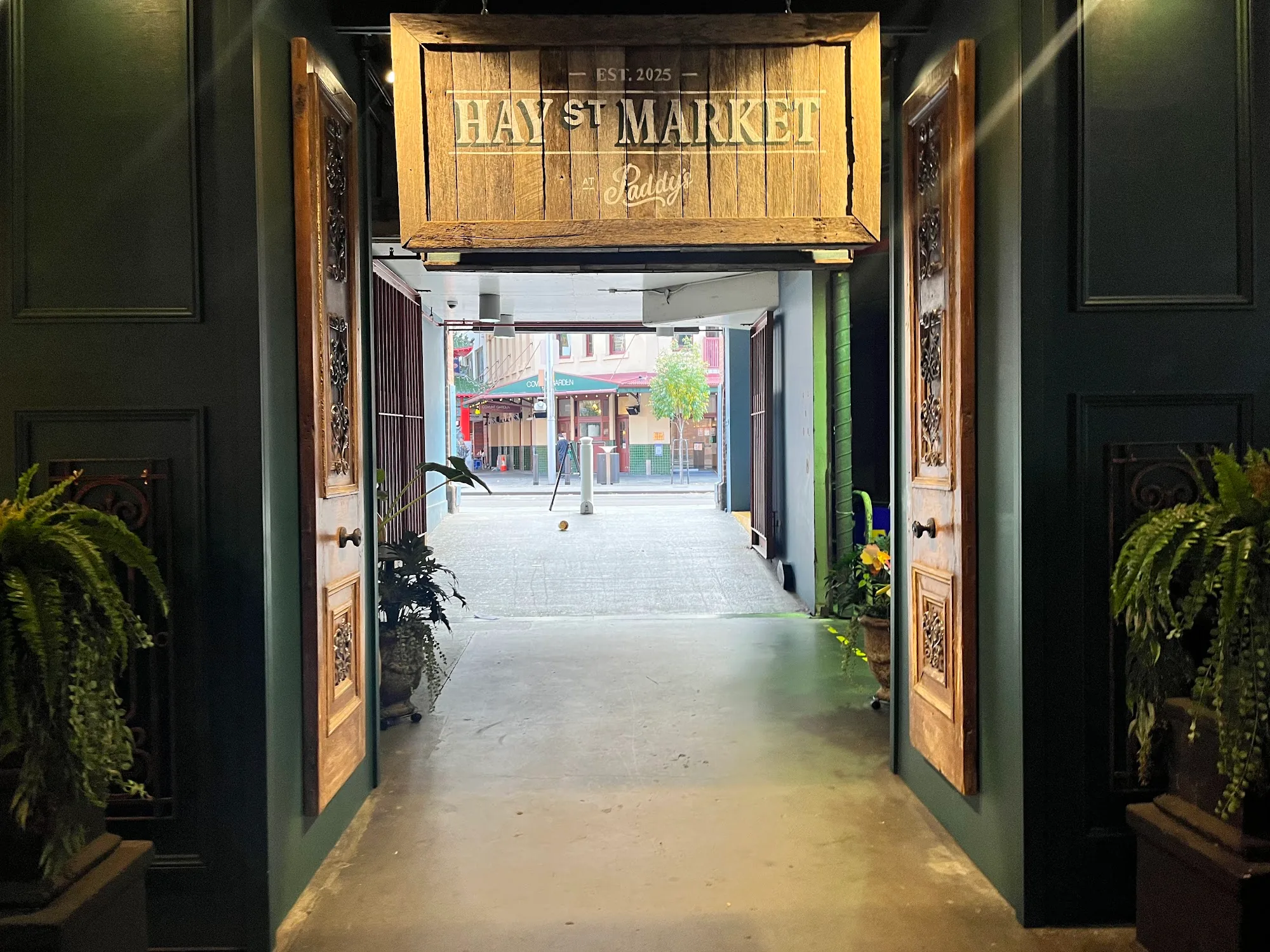 Hay St Market entrance with branded wooden signage in Sydney Haymarket