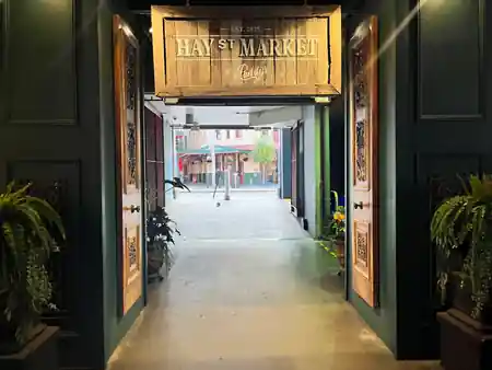 Hay St Market entrance with branded wooden signage in Sydney Haymarket — salsa venue in Sydney