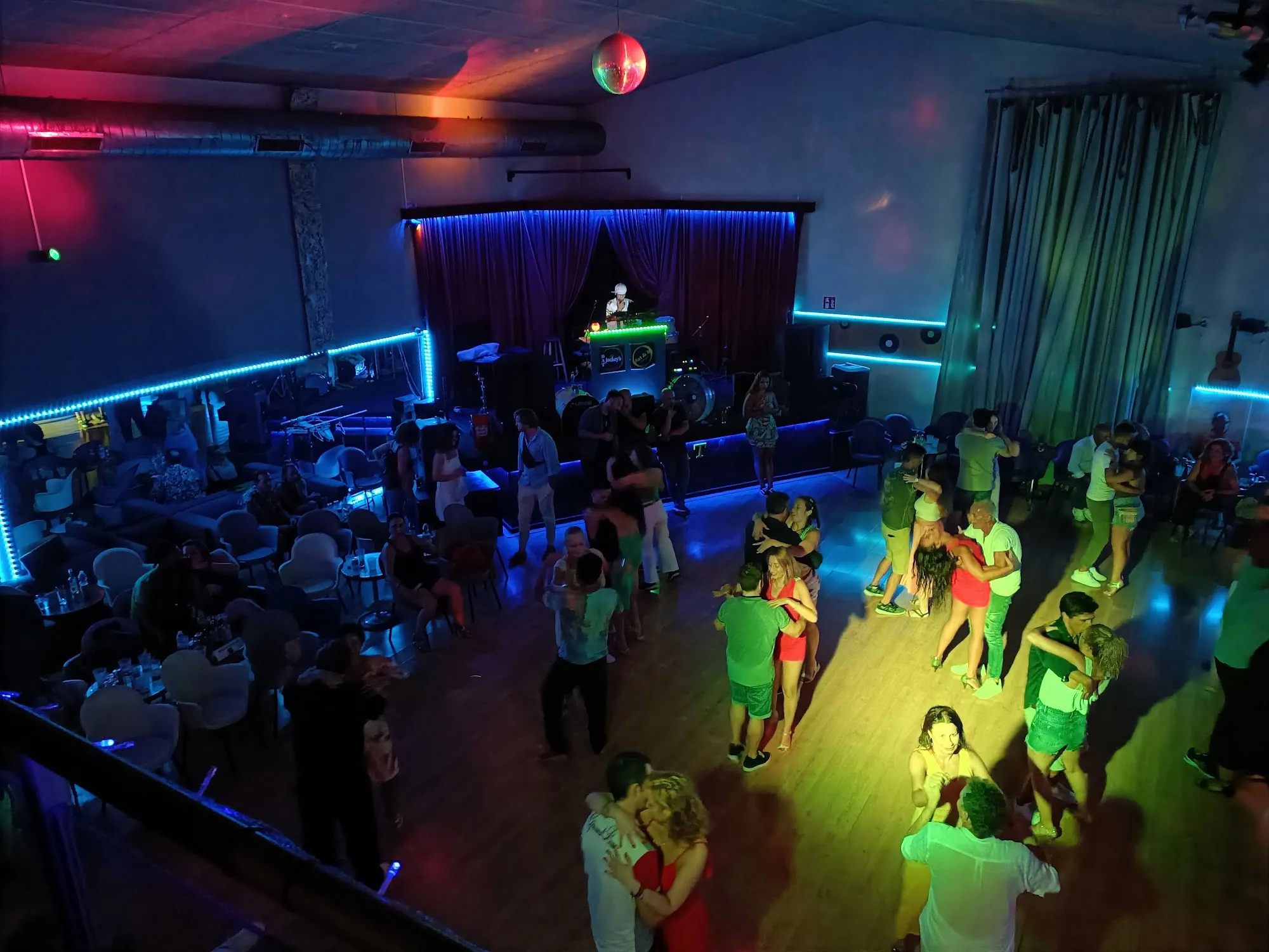 Batjockeys packed dance floor with couples dancing and DJ booth