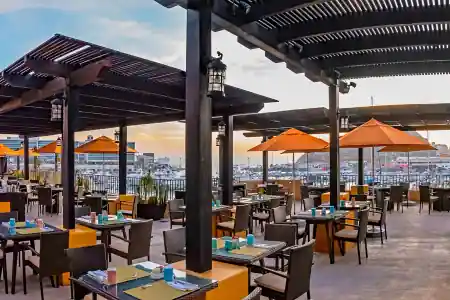 Restaurant dining area at Lighthouse Cabo in Tesoro Los Cabos resort overlooking the marina — salsa venue in Cabo San Lucas