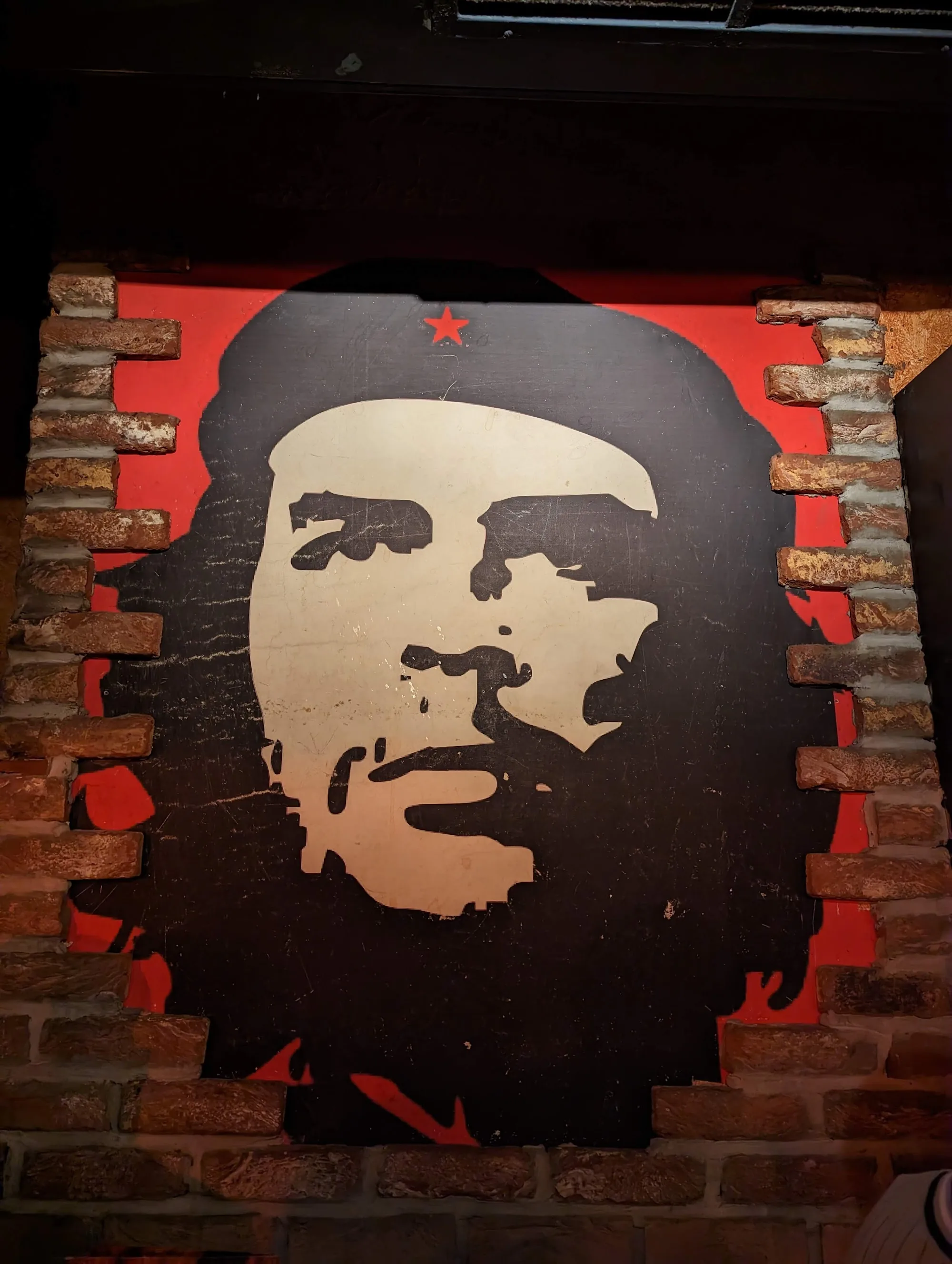 Che Guevara wall art on brick wall at Cuba-Bar Cologne interior