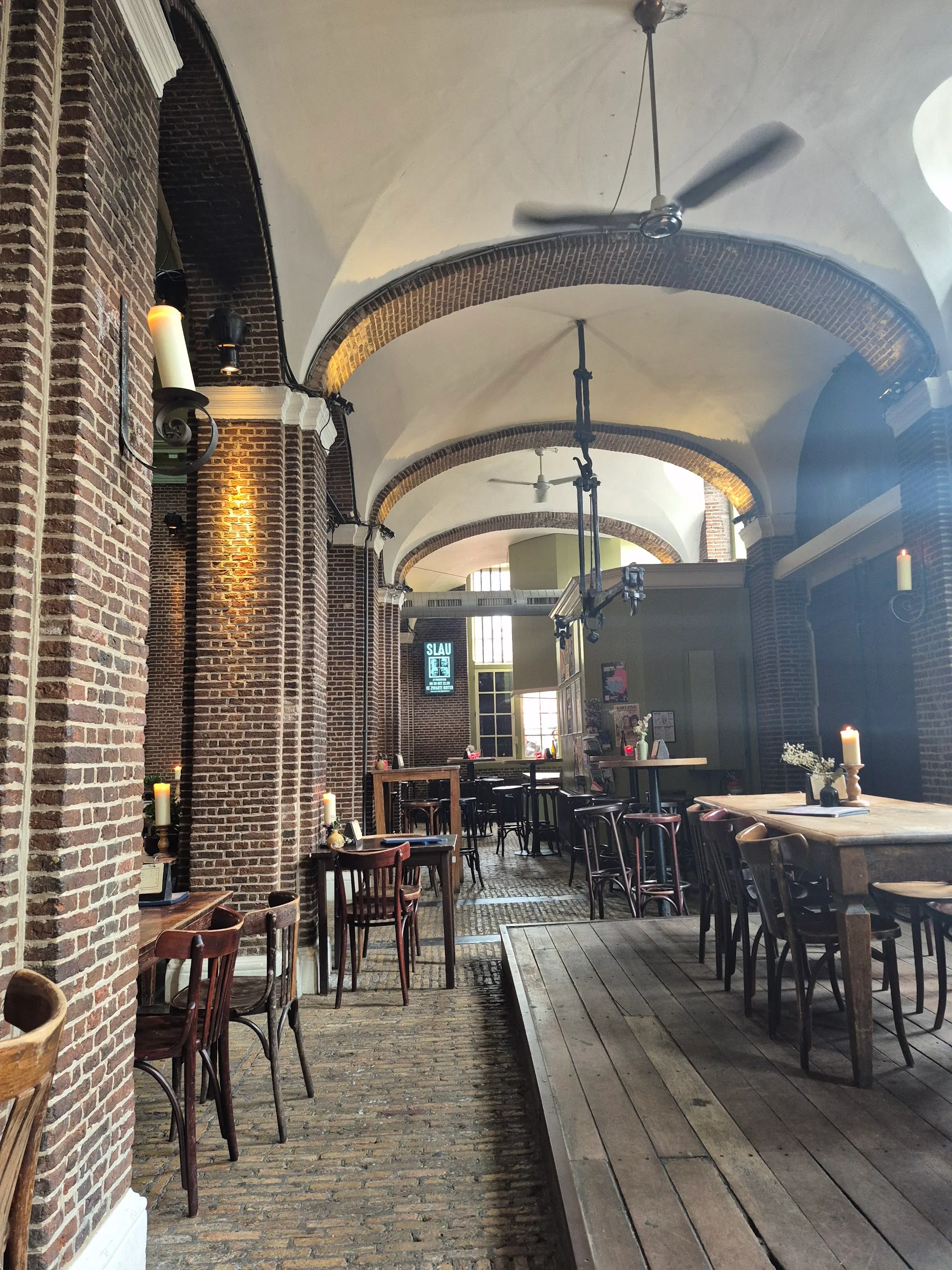 Historic arched hall interior at Stadscafé de Boterwaag Den Haag