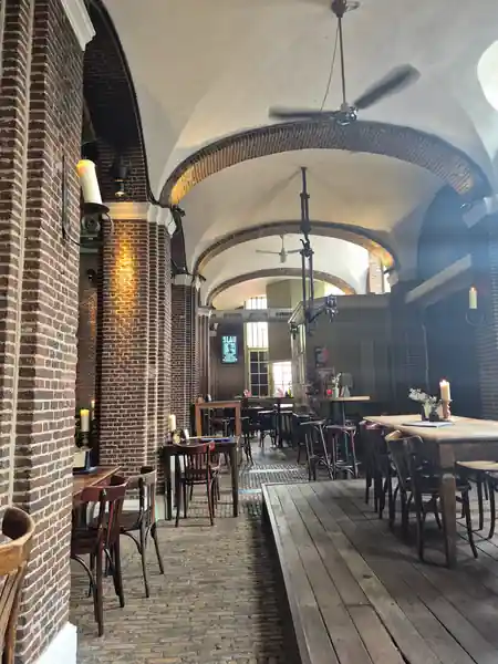 Historic arched hall interior at Stadscafé de Boterwaag Den Haag — salsa venue in Den Haag