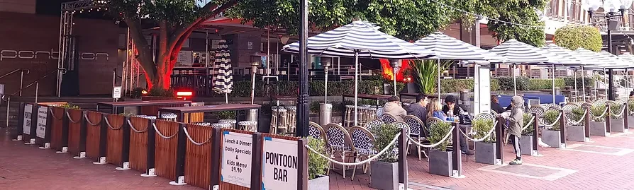 Pontoon Bar exterior terrace with branded signage in Sydney's Darling Harbour — salsa, bachata venue in Sydney