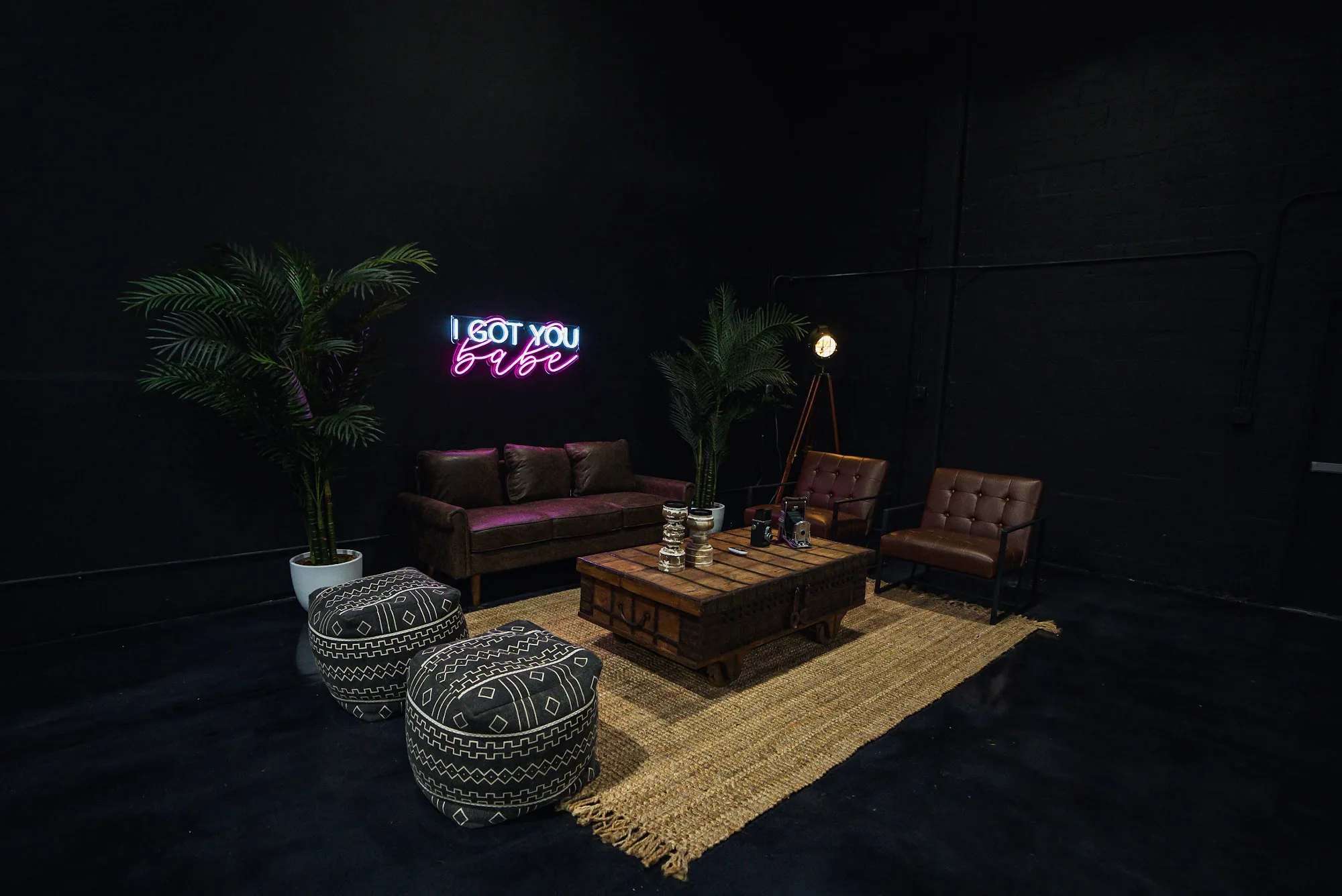 Blackbox Media Miami interior lounge with neon sign, leather sofas and warm lighting, Miami — bachata venue in Miami