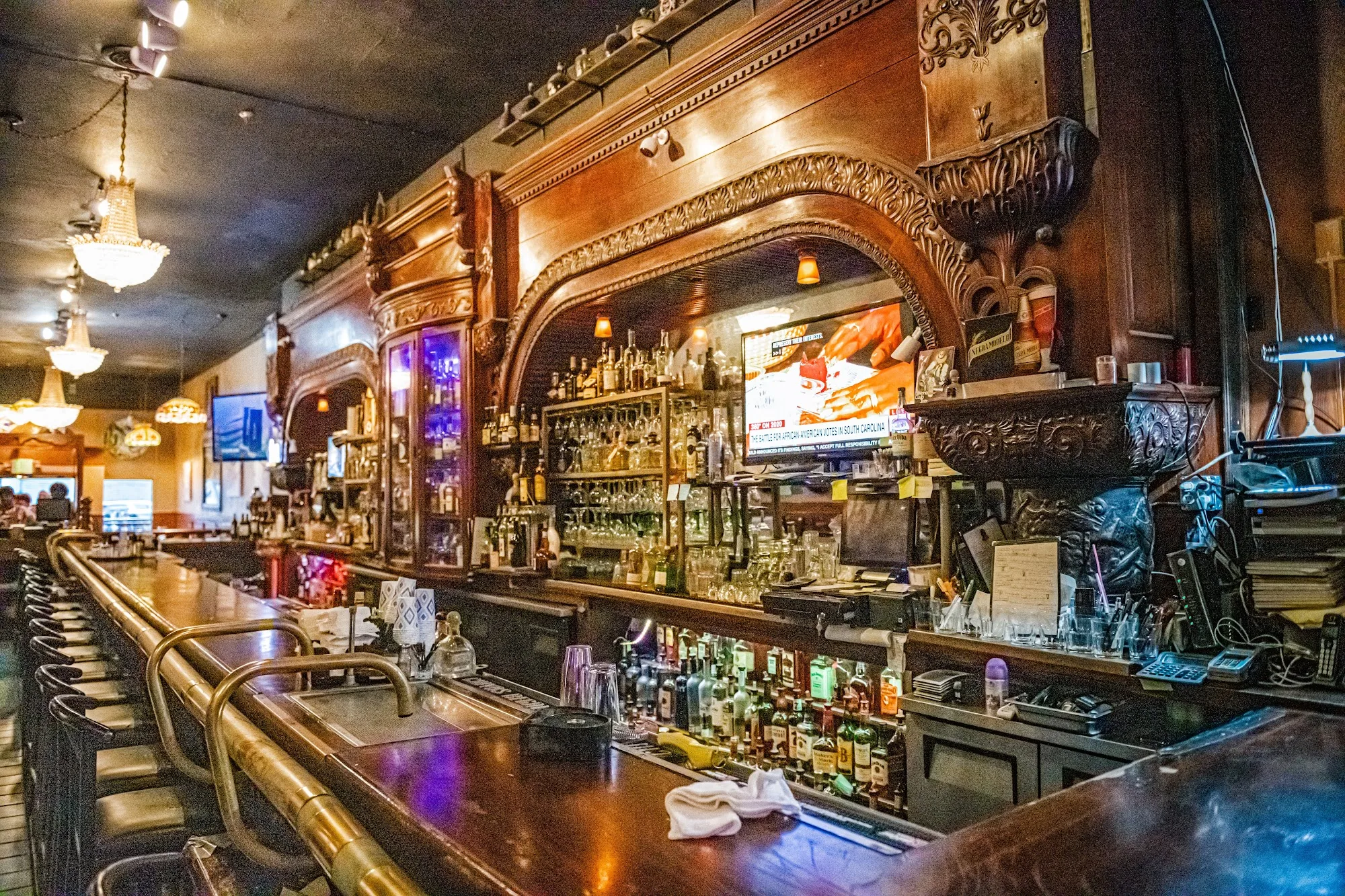 Ornate vintage wooden bar inside El Valenciano in San Francisco