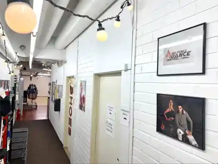 Hallway with branded Helsinki Dance Central signage and string lights inside the Helsinki venue — zouk venue in Helsinki