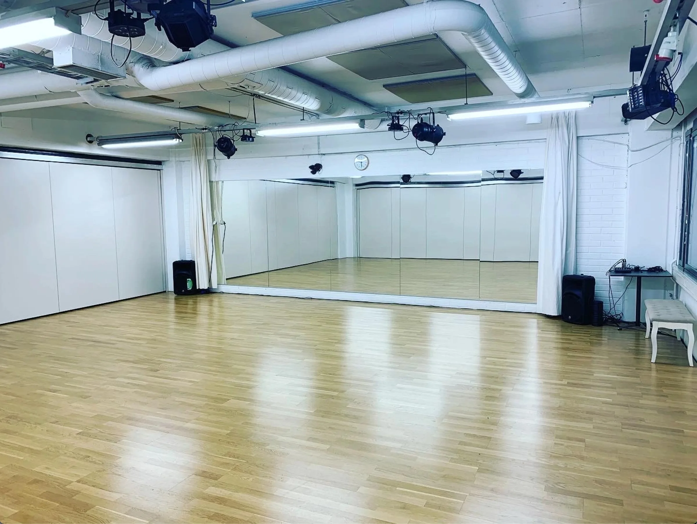 Wooden dance floor and mirrored studio at Helsinki Dance Central in Helsinki