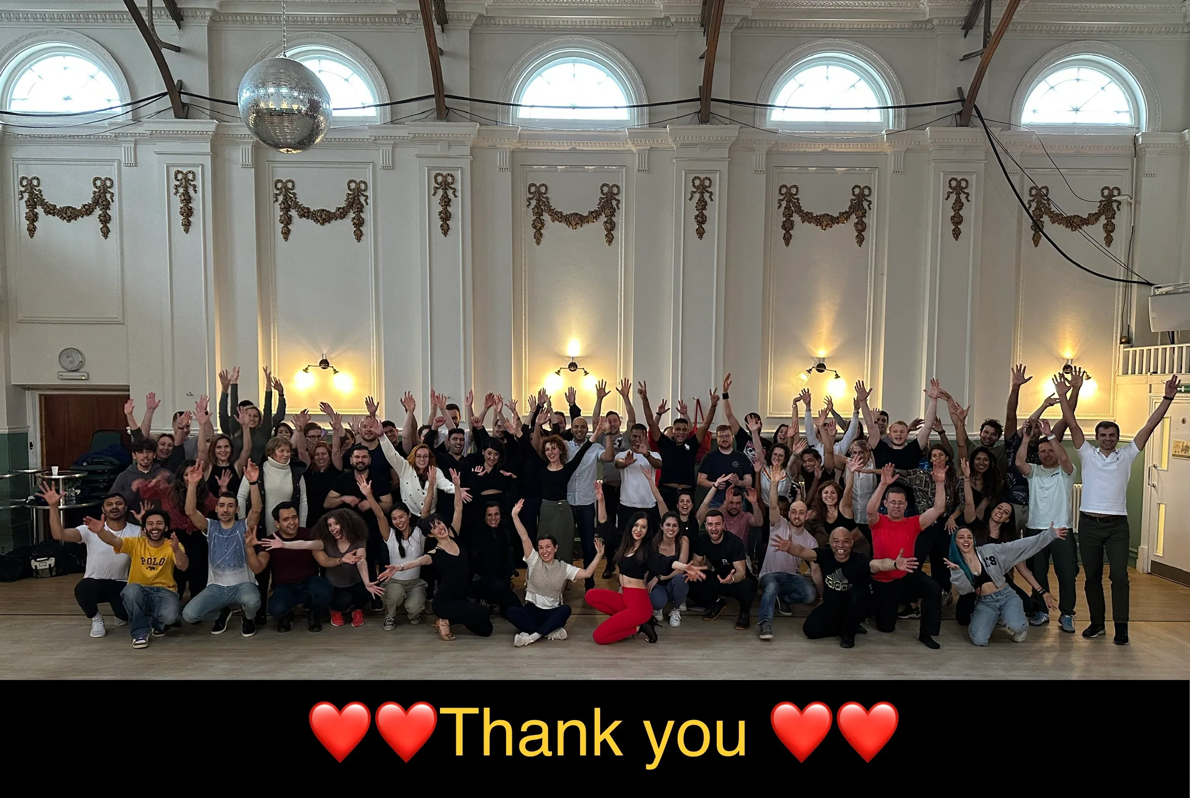 Salsa and bachata dance community group photo inside Drake House Dance Hall, London