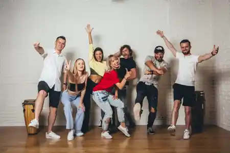 Salsa Libre instructors and students posing in the dance studio in Warsaw