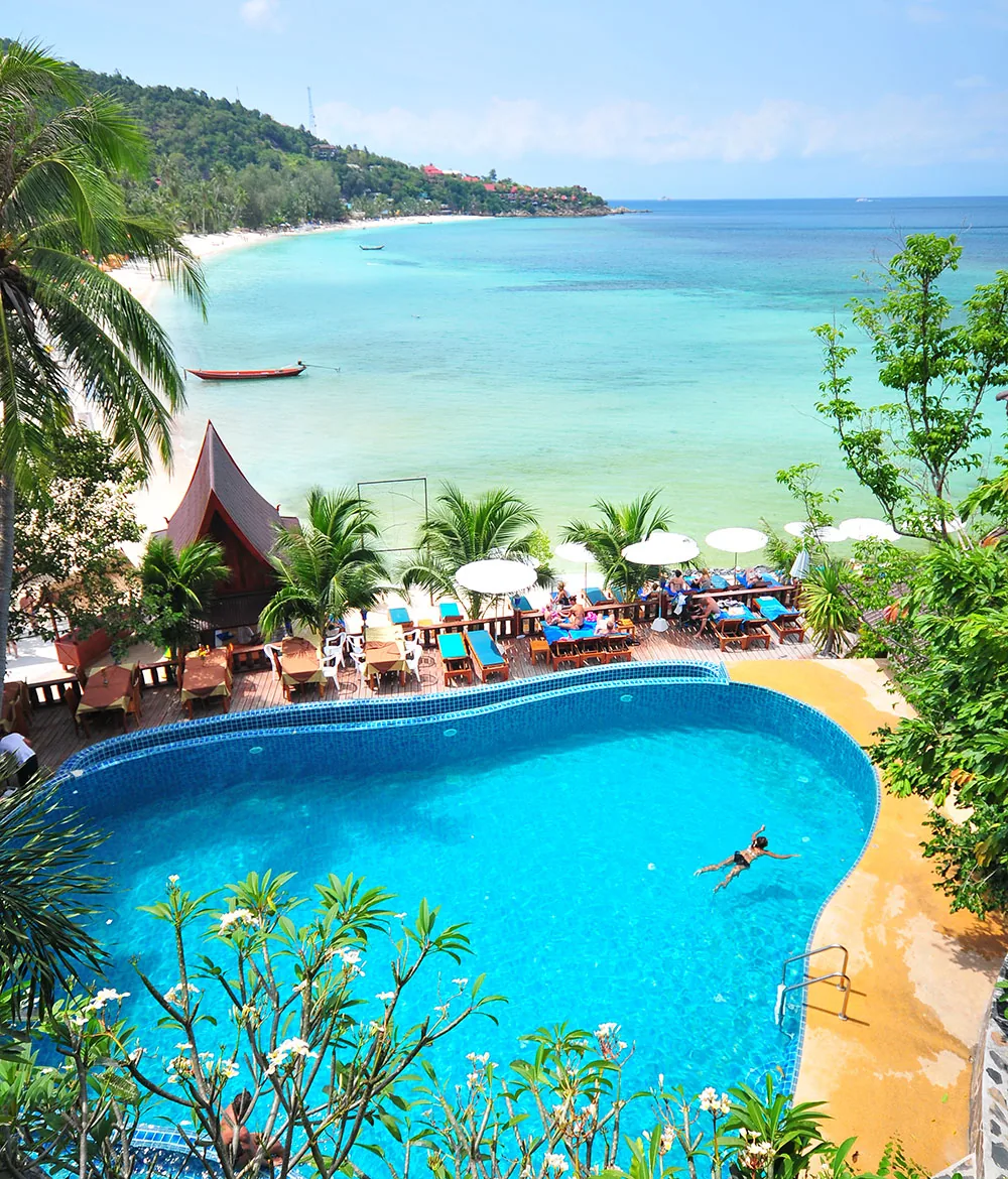 Beachfront pool with sunbeds overlooking Haad Yao bay at Haad Yao Bayview Resort, Koh Phangan