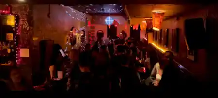 Crowd and party lighting on the upstairs dance floor at Solas Bar NYC — salsa, bachata, zouk venue in New York