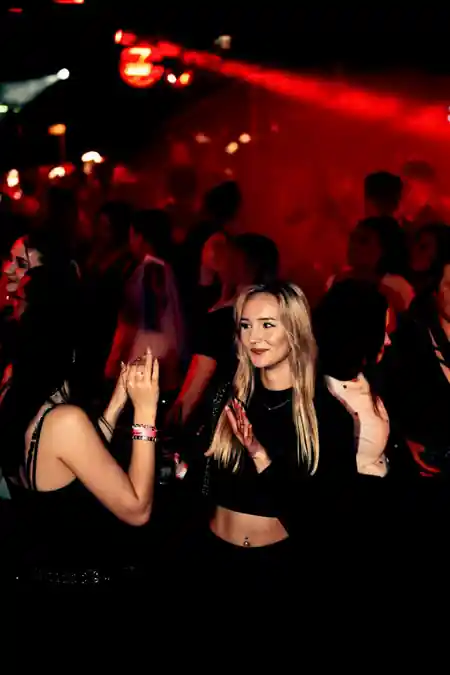 Partygoers under red club lighting at 7GradX in Stuttgart — salsa venue in Stuttgart