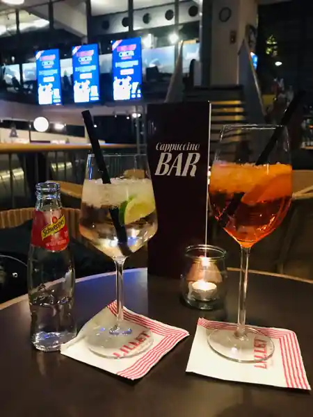 Cappuccino Bar interior at Cinecitta Nuremberg with cinema screens and cocktails — salsa, bachata, kizomba venue in Nuremberg