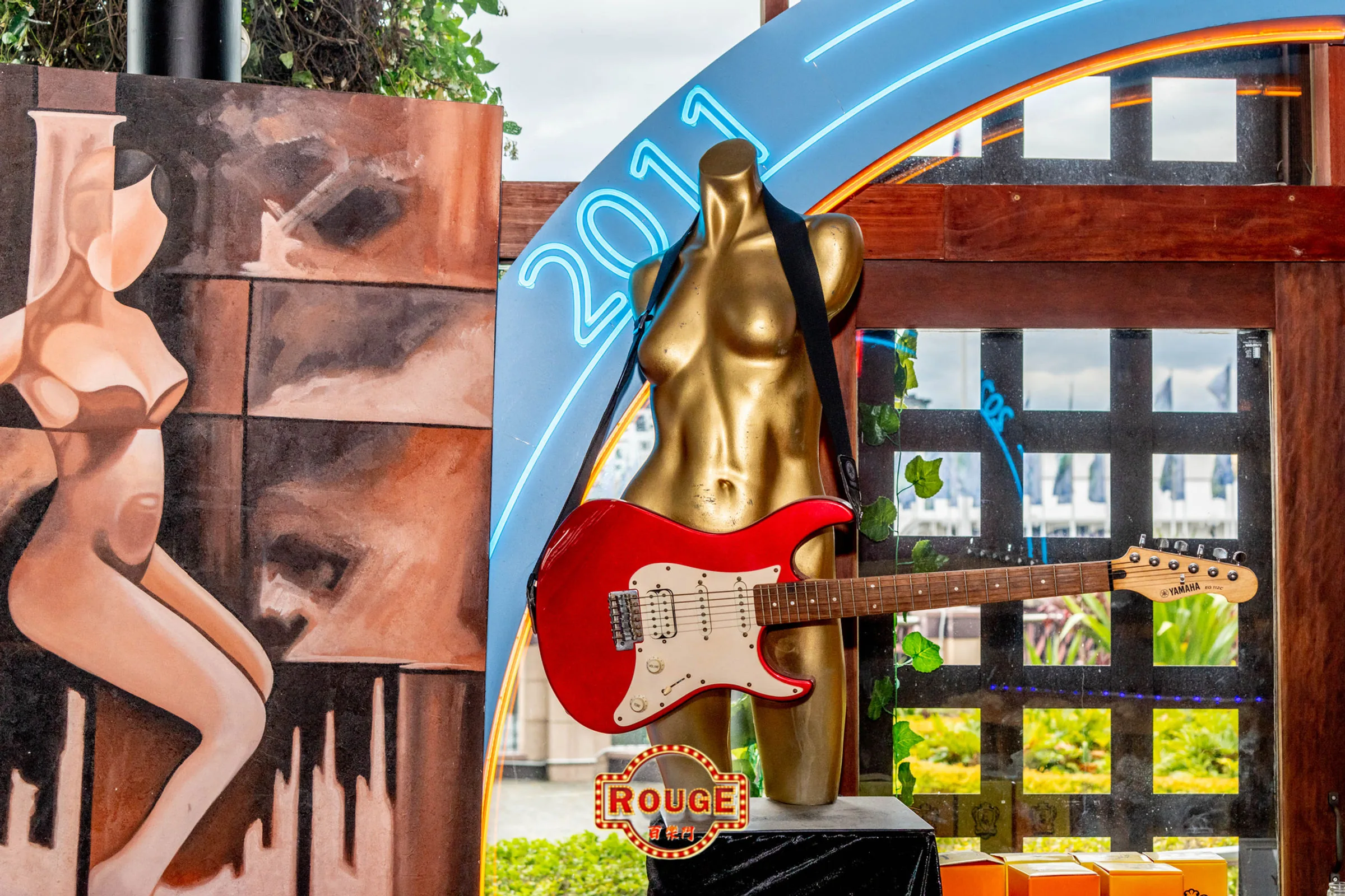 Rouge Bar entrance sculpture with guitar at Darling Harbour, Sydney