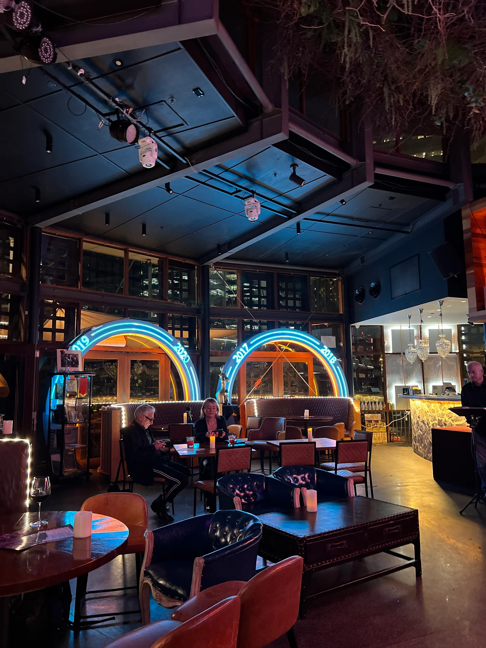 Interior lounge seating and neon-lit bar atmosphere at Rouge, Darling Harbour Sydney