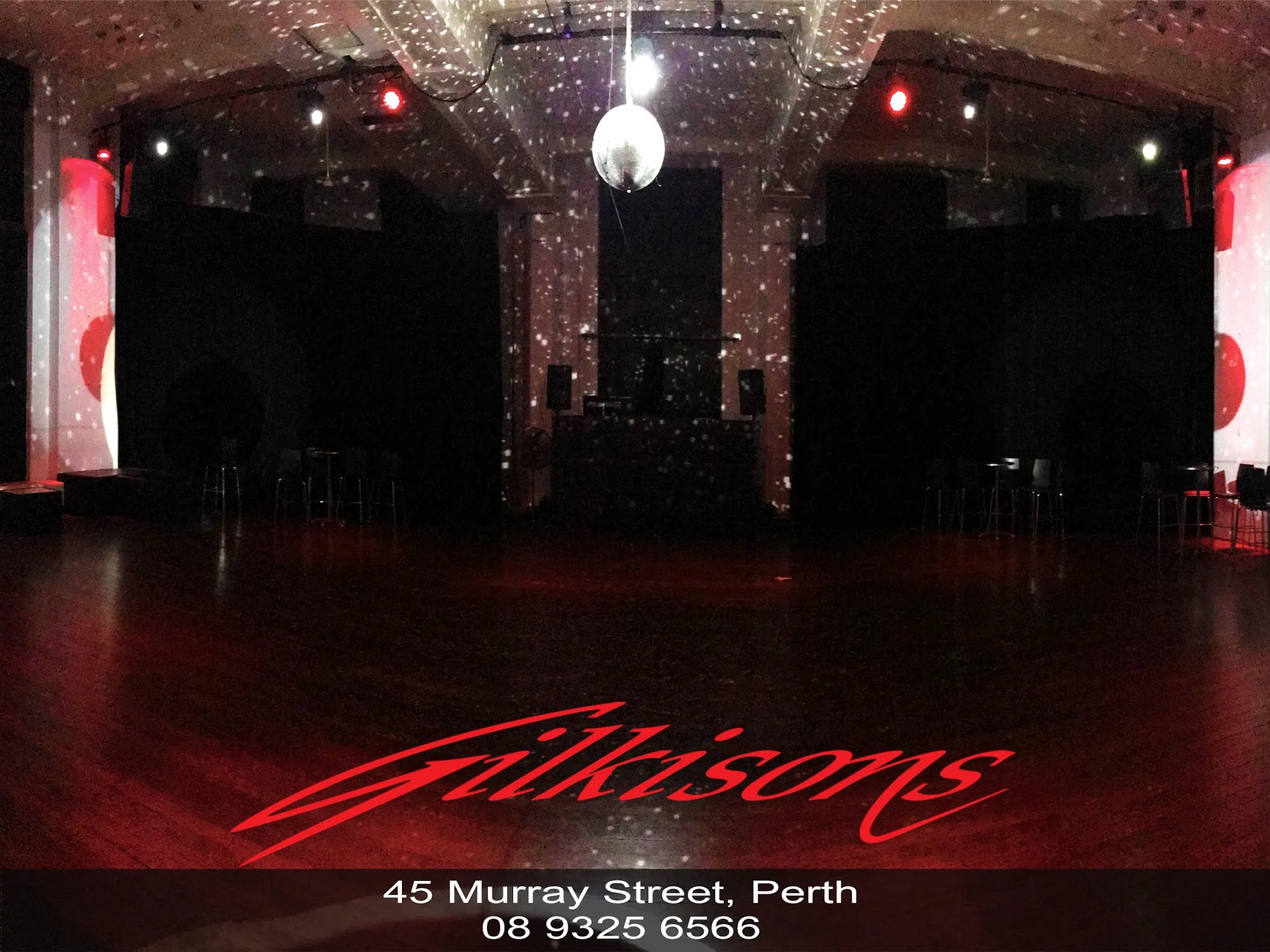 Empty dance floor with mirror ball and stage lighting at Gilkisons Dance Studio Perth