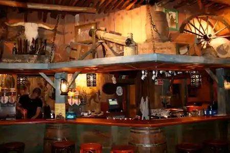 Rustic Western-themed bar interior at Zapata Juan-les-Pins France — salsa, bachata venue in Juan-les-Pins