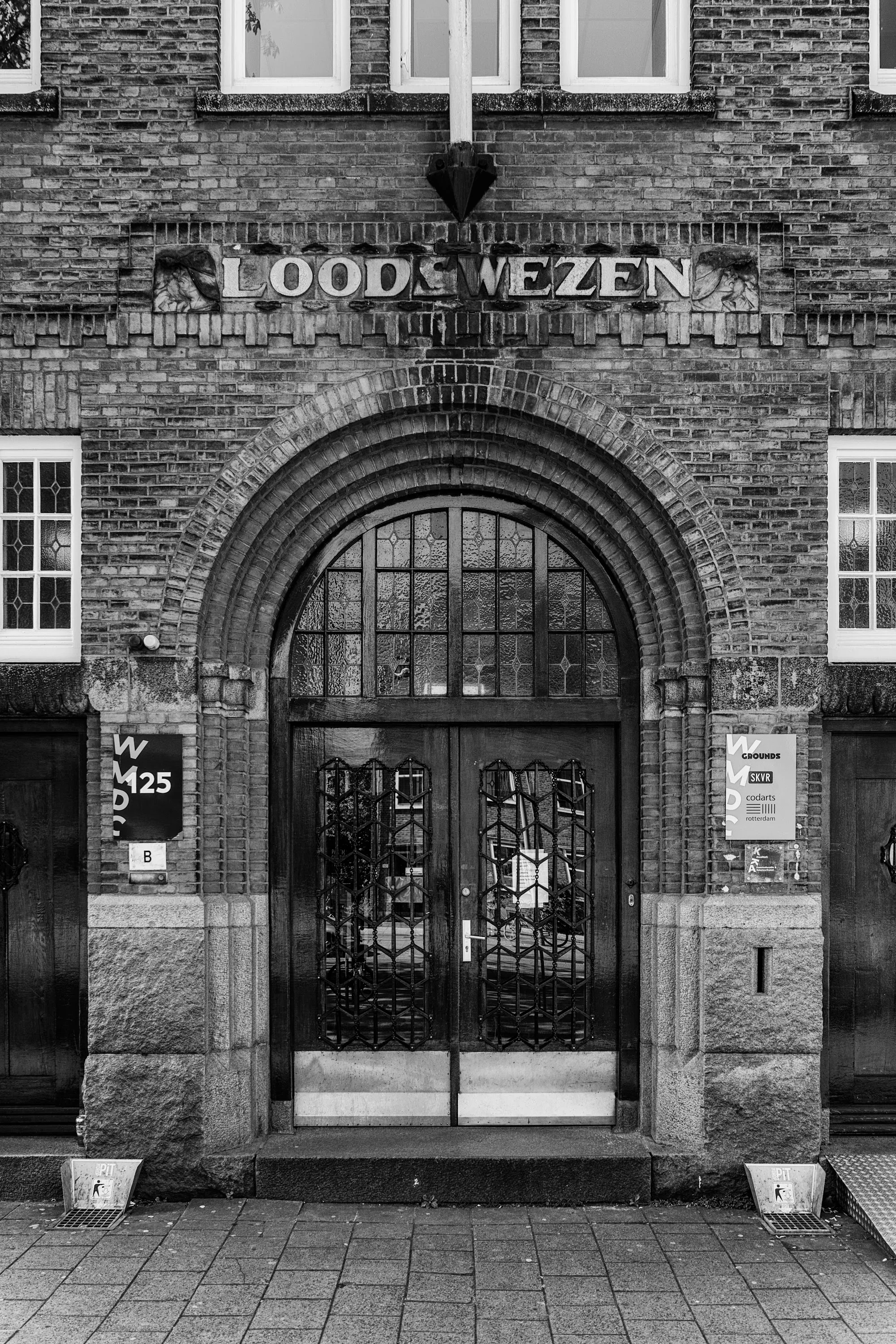 Grounds Rotterdam historic Loodswezen entrance facade in black and white