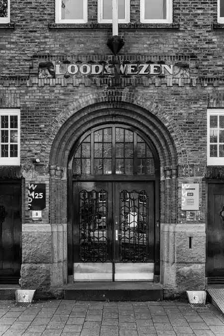Grounds Rotterdam historic Loodswezen entrance facade in black and white — salsa, bachata venue in Rotterdam