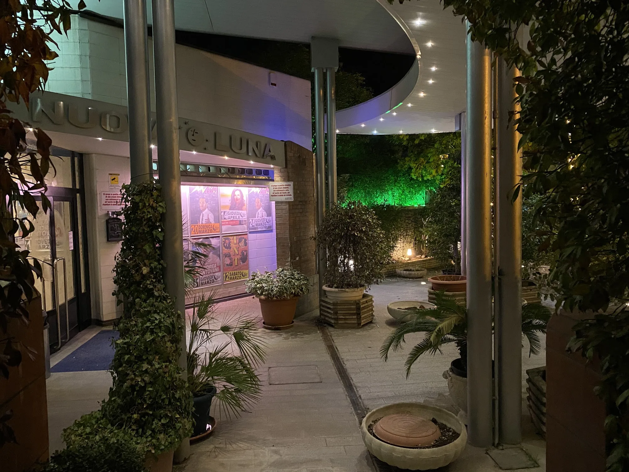 C.Luna entrance with plants and warm lighting at Discoteca Nuova Luna Italy
