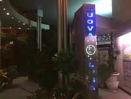 NUOVA LUNA illuminated sign at the disco entrance in Sala Bolognese Italy — bachata, salsa venue in Sala Bolognese