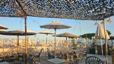 Beach terrace at Le Vieux Rocher with parasols and sea view in Golfe Juan — kizomba, bachata, salsa venue in Golfe Juan
