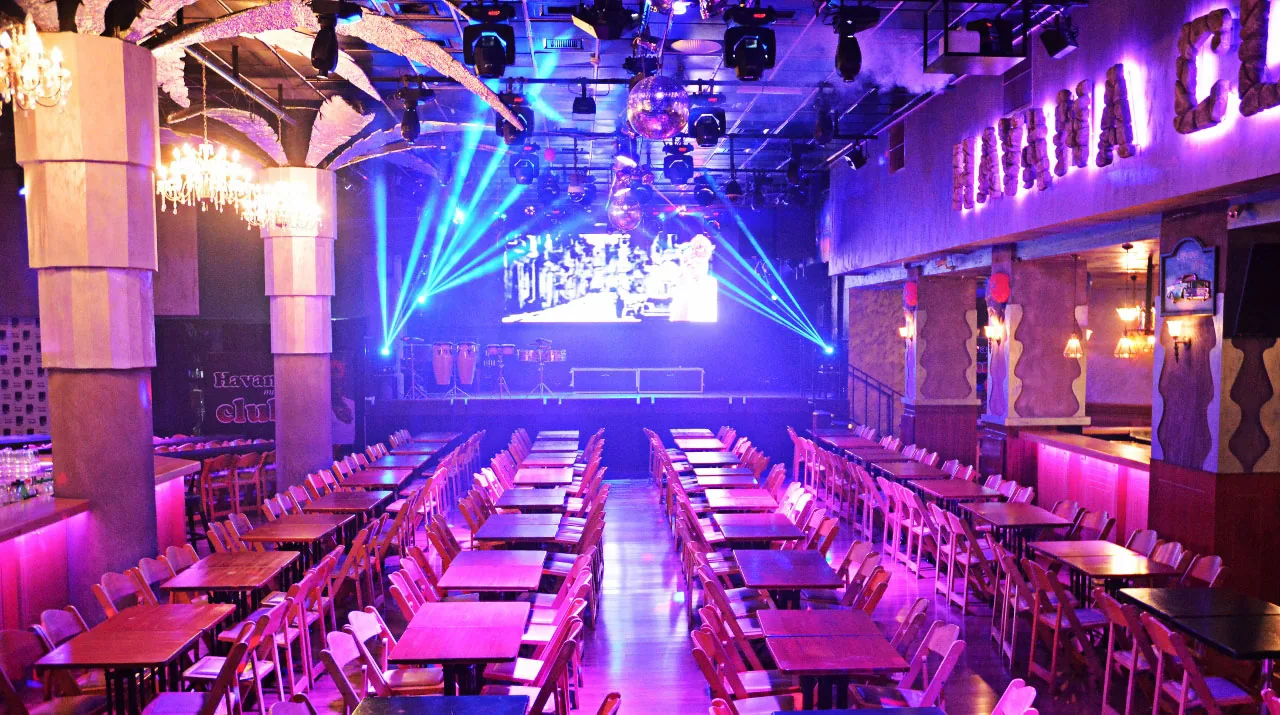 Ballroom interior of Havana Club Tel Aviv with stage screen and party lighting
