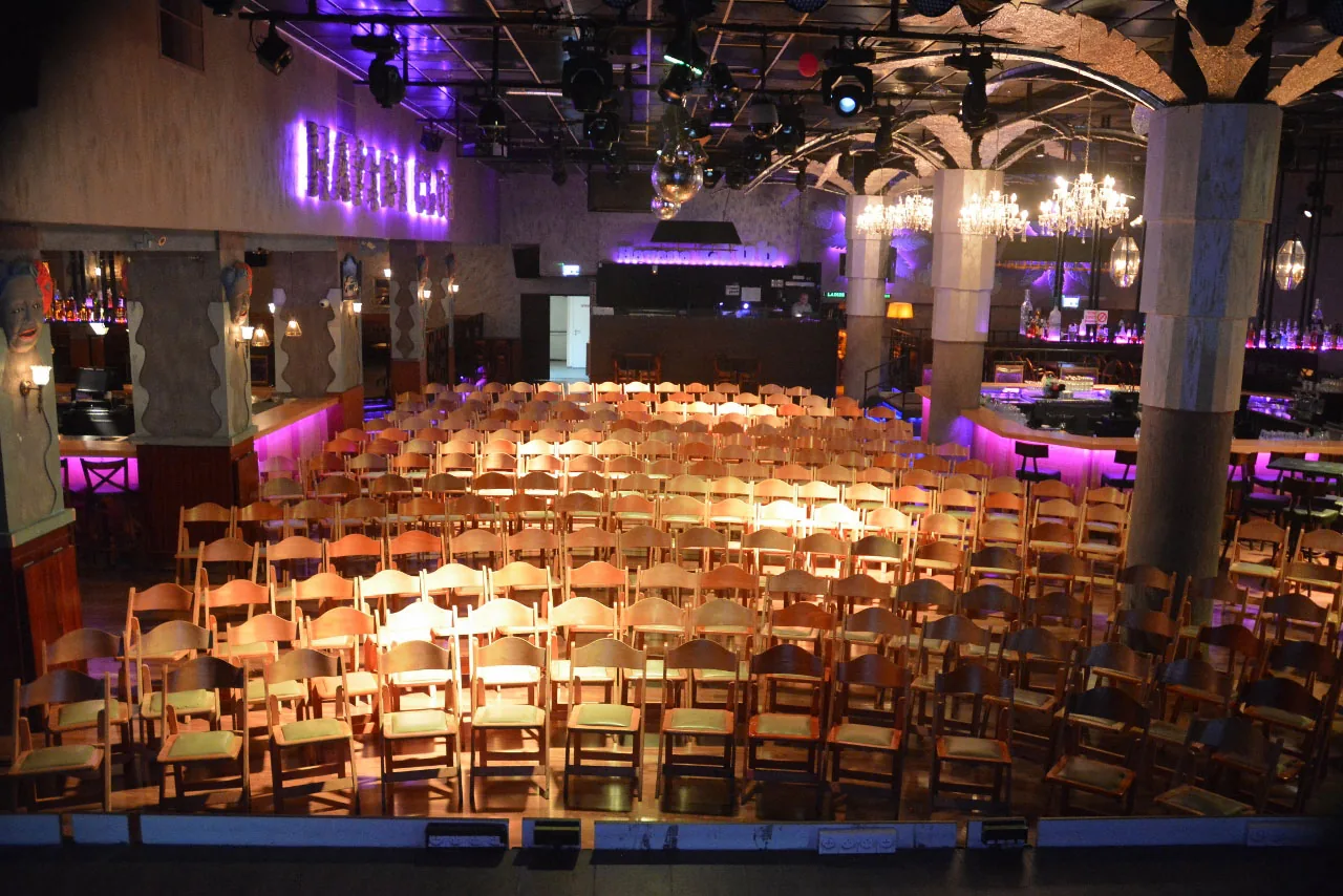 Havana Club Tel Aviv interior from above with seating rows and bar with chandeliers