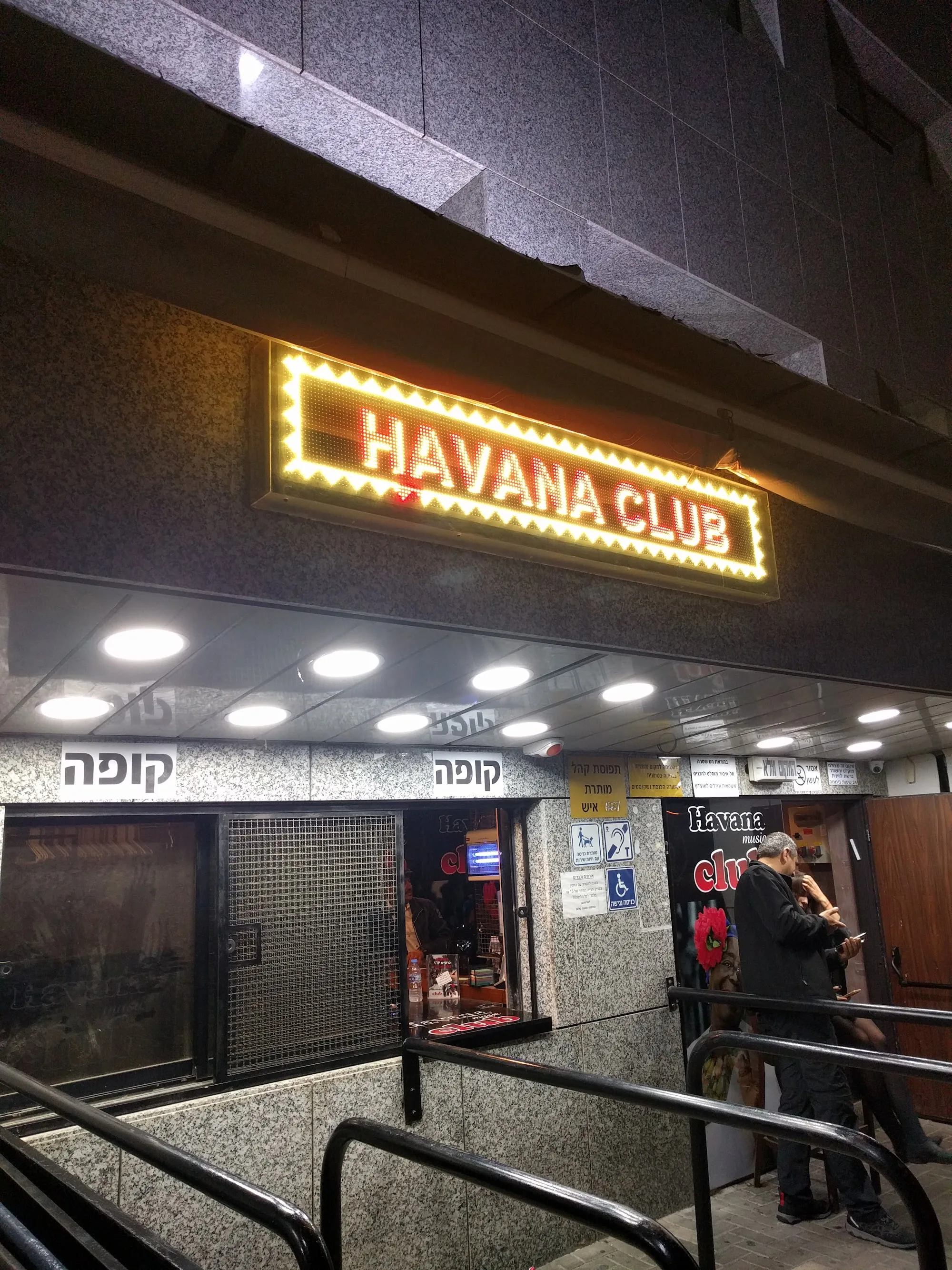 Havana Club entrance with illuminated marquee sign in Tel Aviv at night