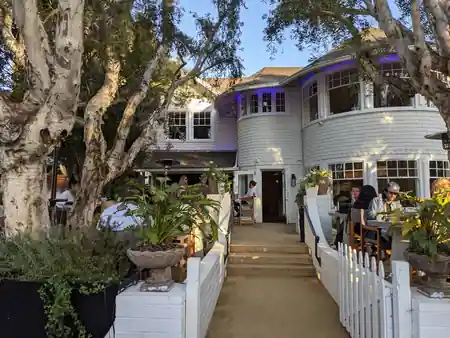 White wooden Victorian-style venue exterior with garden path in Los Angeles — salsa, bachata venue in Los Angeles