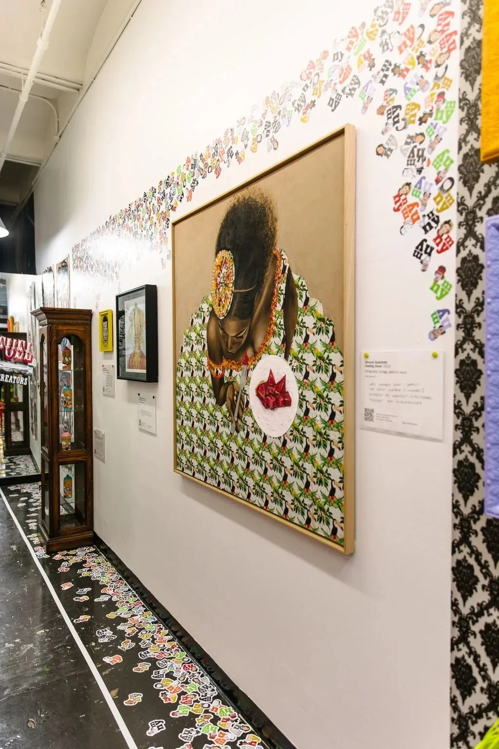 Art exhibition gallery space inside Chelsea Market New York with concrete floors and feature artwork