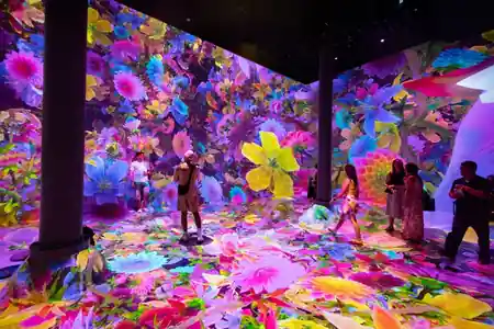 Immersive floral light installation event at Chelsea Market New York with crowd of attendees — salsa, bachata, mix venue in New York