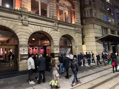Evening crowd queues at the arched entrance of Establishment Bar Sydney for a Saturday night out — salsa, bachata, merengue venue in Sydney