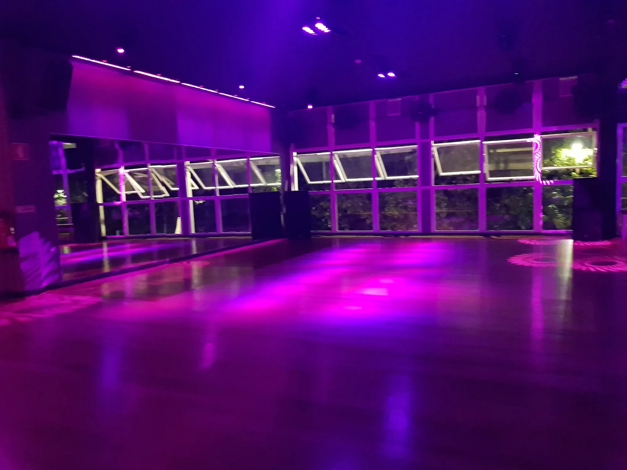 Empty dance floor with vibrant purple stage lighting at Top Floor Club Lisbon