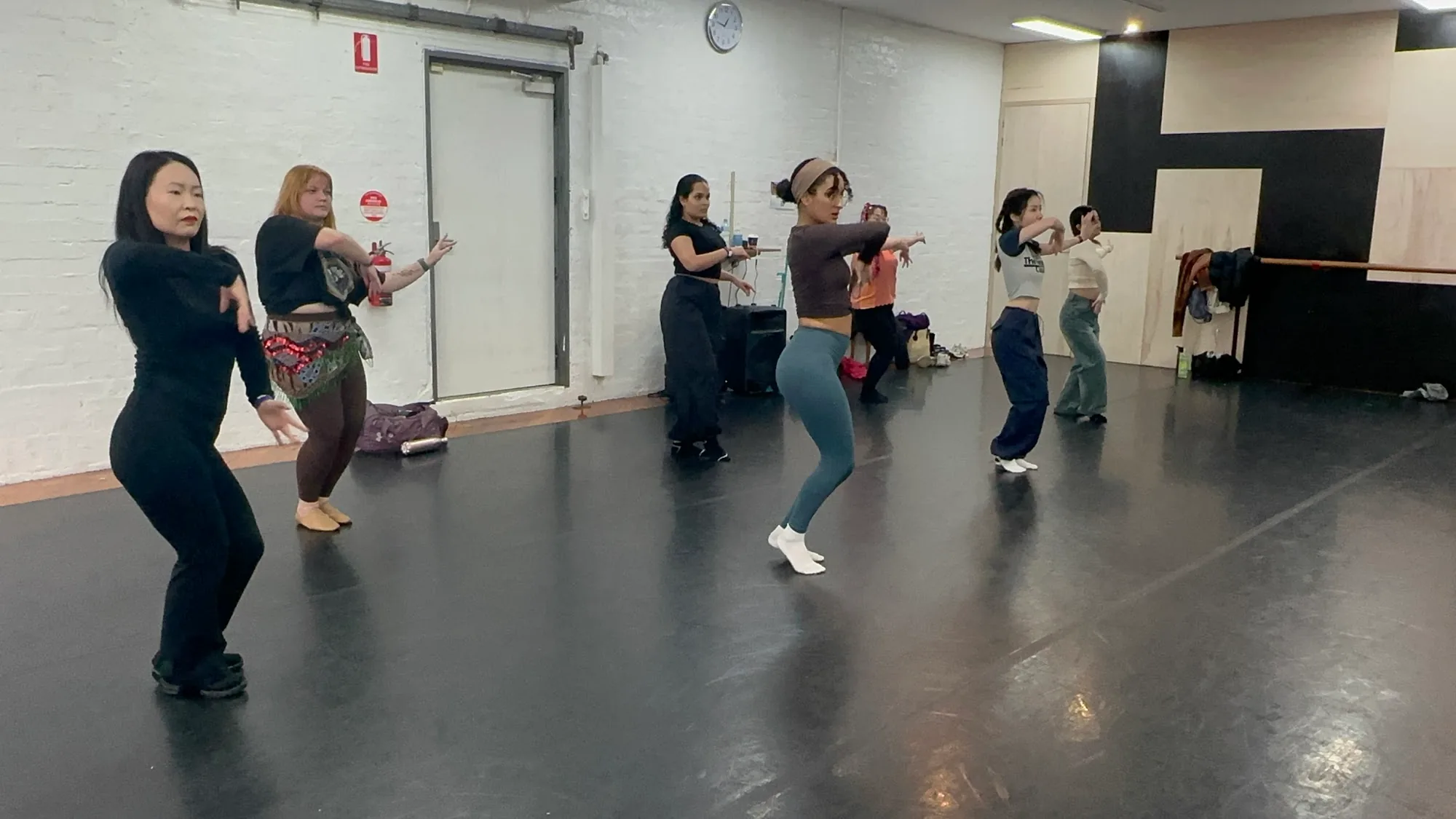 Dancers practicing in the white-brick studio room at The Space Dance & Arts Centre Melbourne
