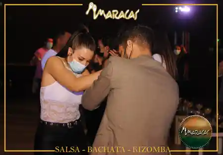 Partner dancing couple on dance floor at Sala de Baile Maracas Fuenlabrada Spain — salsa, bachata, kizomba venue in Fuenlabrada